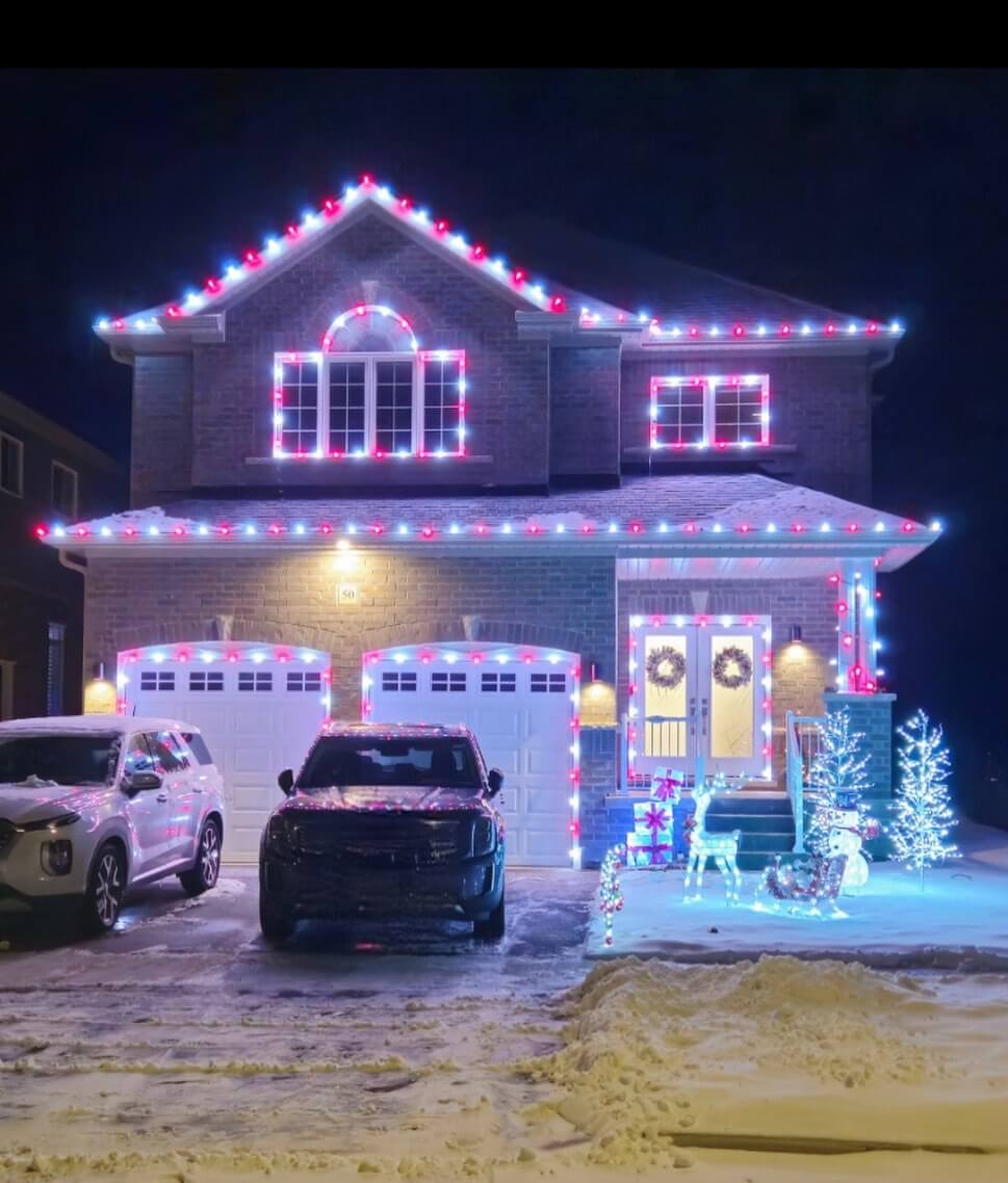 Permanent red and cool white architectural lighting on a two-storey home in Clarington
